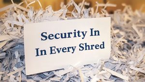 "Security in every shred" written on a paper surrounded by shredded paper pieces